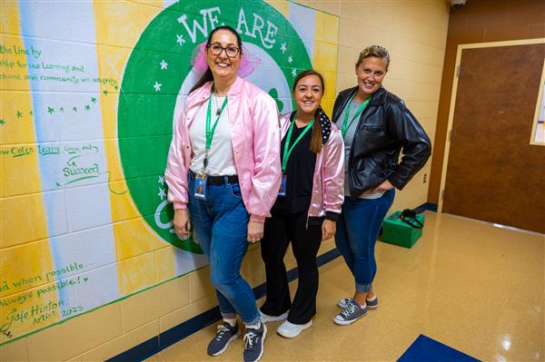 three teachers in jackets and bandanas